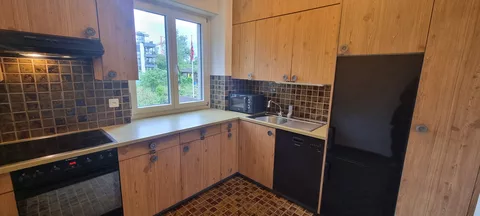 Modern Kitchen with oven, fridge and microwave
